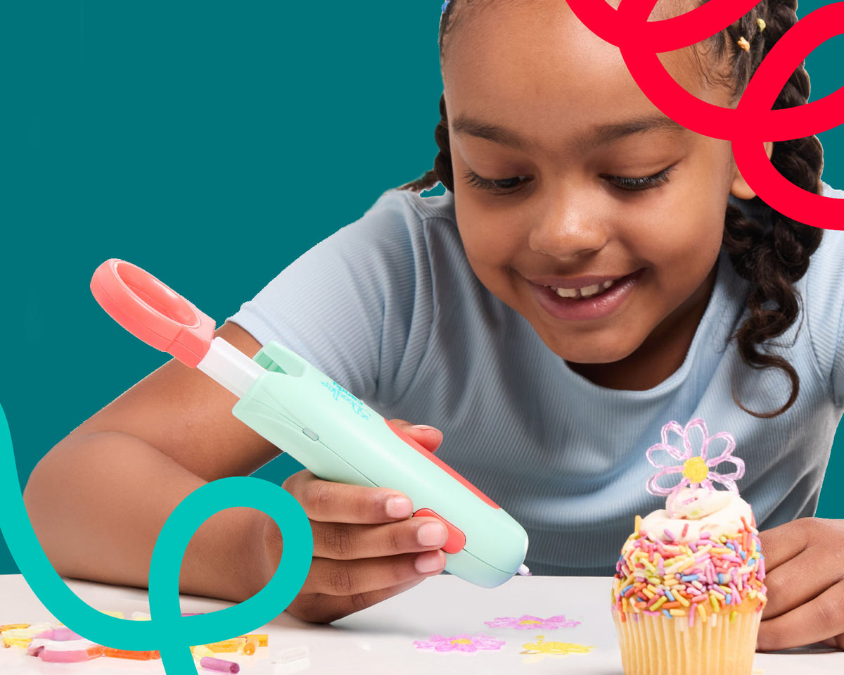 Girl using 3Doodler Candy pen to make edible sunflowers
